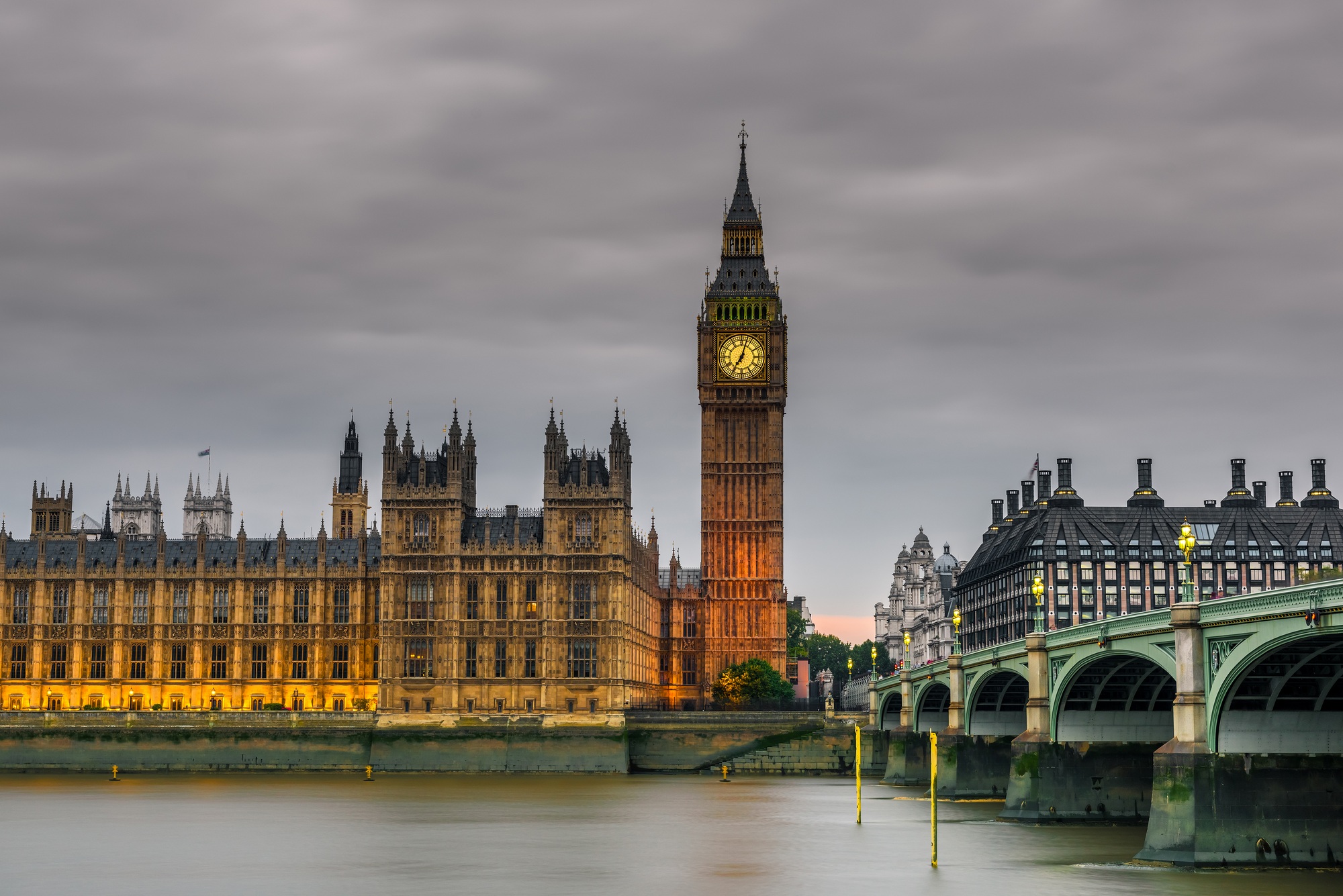 Westminster abbey and big ben in the London skyline at night, London, UK