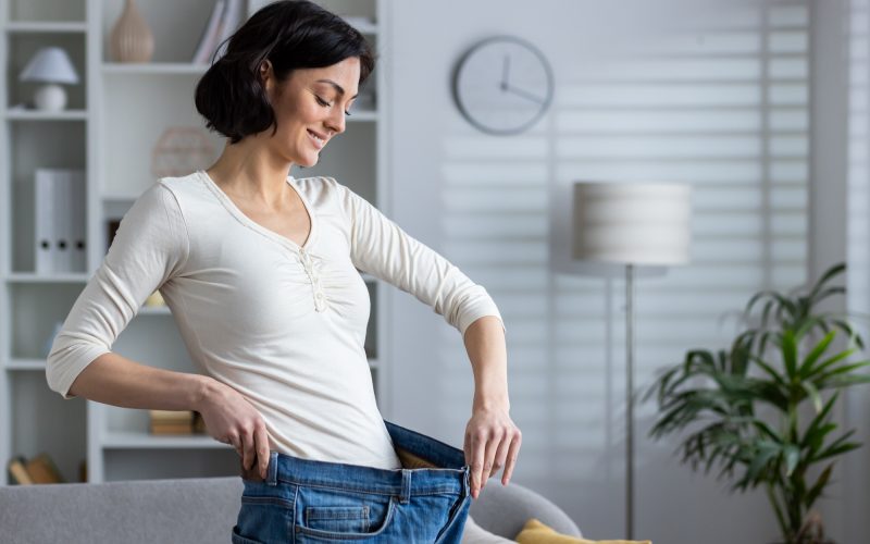 Woman smiling after successful medical weight loss treatment